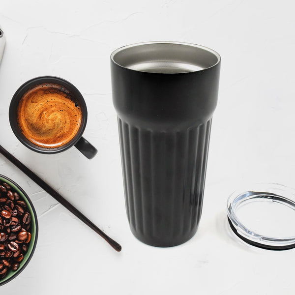 Stainless steel travel mug with vacuum insulation for coffee.