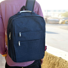 Laptop bag in use, carrying a laptop.