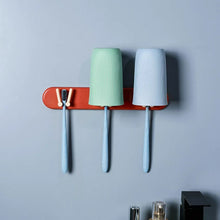 Wall-mounted organizer, plastic holder with shelf and hooks for bathroom use.