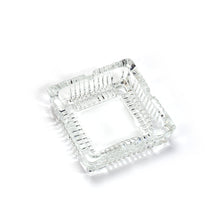 Square glass ashtray with clean design.