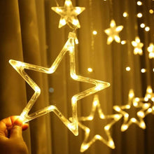 Festive window lights with flashing star designs