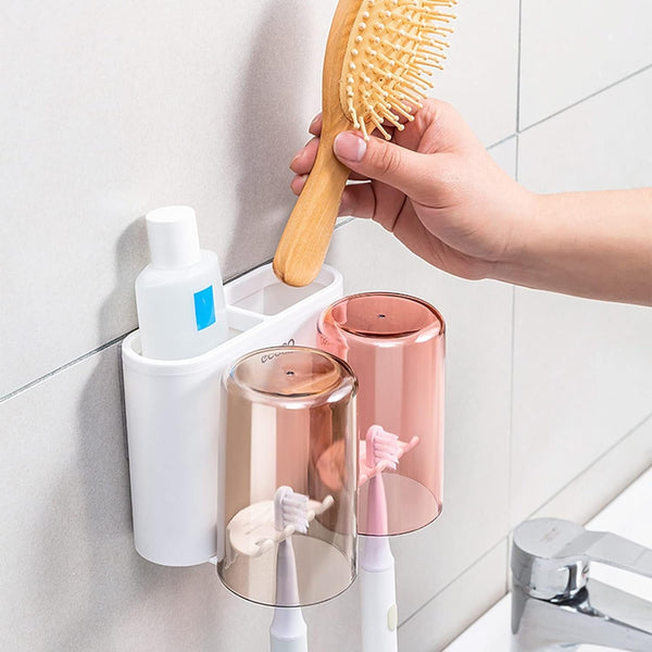 Wall-mounted toothbrush holder with two cups for bathroom organization.