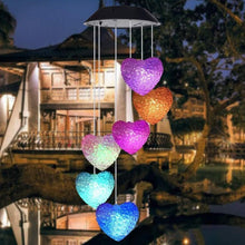 Solar-powered wind chimes with LED lights, perfect for garden decoration.