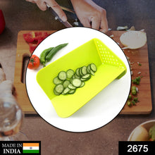 Chopping board with stand for cutting vegetables, fruits, and meats.