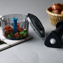 Push chopper with lock feature, ideal for kitchen use